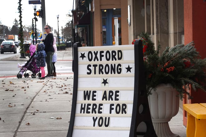 A sign in downtown on Dec. 2, 2021 shows support for the students and staff killed and wounded in the Nov. 30 shooting at Oxford High School.