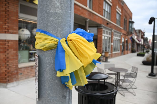 Blue and yellow ribbons are seen along Washington Street near Burdick Street in downtown Oxford on Thursday, December 2, 2021.
