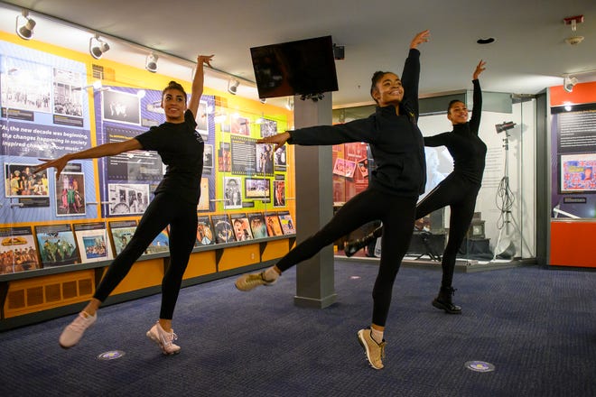 Dance Theatre of Harlem performers Kamala Saara, left, Alexandra Hutchinson, middle, and Lindsey Donnell, right, perform a dance to the Stevie Wonder hit "Higher Ground" during a visit the Motown Museum, Tuesday, Dec. 14, 2021. The group will be performing at Michigan Opera Theatre in January.