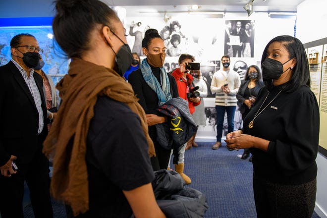 Robin Terry, Chairwoman and CEO of the Motown Museum, right, welcomes members of the Dance Theatre of Harlem, Resident Choreographer Robert Garland, left,  Kamala Saara, middle, and Lindsey Donnell, second from right, as they visit the Motown Museum, Tuesday, Dec. 14, 2021. The group will be performing at Michigan Opera Theatre in January.