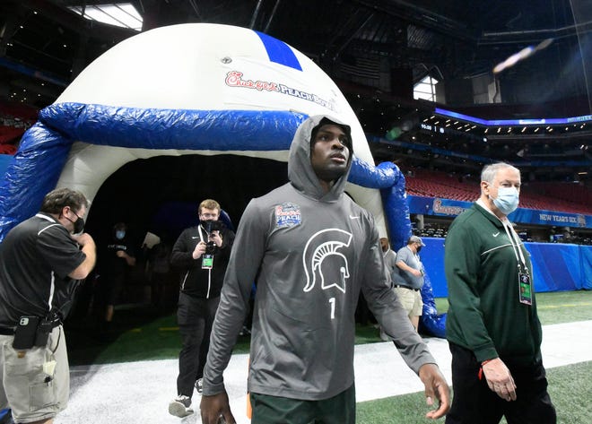 Michigan State's Jayden Reed makes his way onto the field at Mercedes Benz Stadium before the start of the Peach Bowl against Pitt in Atlanta, Georgia on December 30, 2021.
