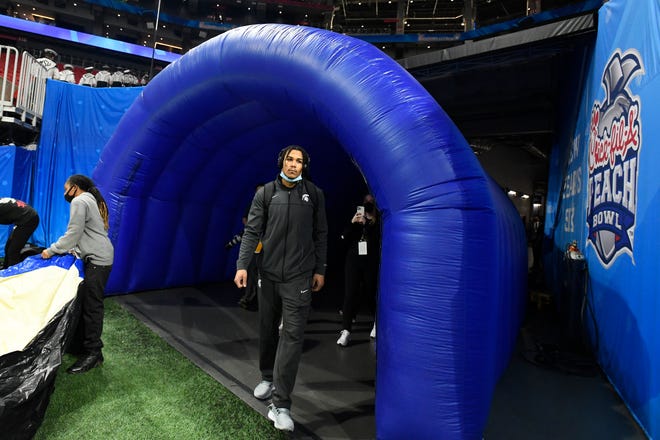 Michigan State wide receiver Jalen Nailor walks onto the field after arriving at the Mercedes Benz Stadium before the Peach Bowl against Pitt.