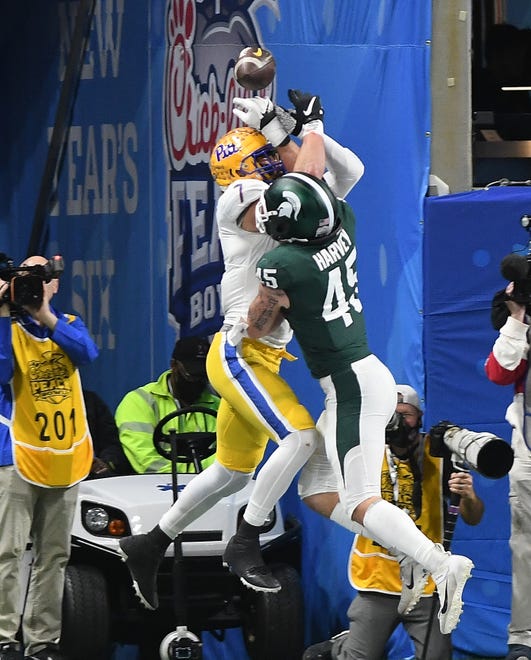 Michigan State's Noah Harvey knocks the ball out of Pitt's Lucas Krull for an incompletion in the end zone in the first quarter.