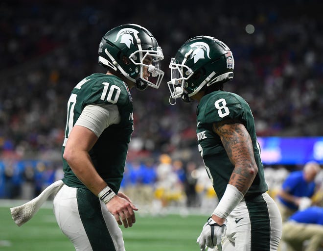 Michigan State quarterback Payton Thorne and Jalen Nailor celebrate Nailor's two-point conversion in the fourth quarter.