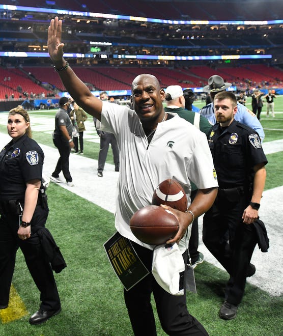 MSU head coach Mel Tucker waves to the Spartan fans still in Mercedes Benz Stadium after beating Pitt in the Peach Bowl.  Michigan State University and Pitt in the 2021 Peach Bowl at Mercedes Benz Stadium in Atlanta, Georgia on December 30, 2021.  (Image by Daniel Mears/ The Detroit News)