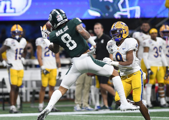 Michigan State's Jalen Nailor brings in a one-handed reception in front of Pitt's Brandon Hill in the second quarter.