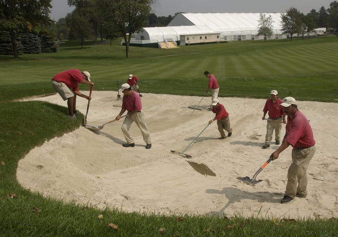 Oakland Hills County Club Turf Care Center employees and Ryder Cup staff continue to make preparations for The 35th Ryder Cup Matches at Oakland Hills, Friday, September 3, 2004. Here they rebuild the left trap in front of the eighth hole on the South Course.