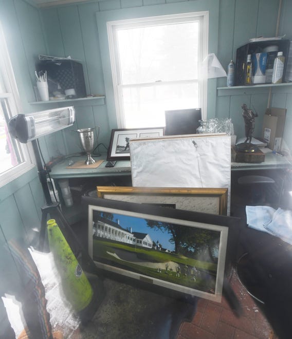 Pieces of artwork and memorabilia were saved from the burning main building at Oakland Hills Country Club and placed into the main guard shed, to be retrieved later.