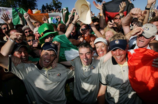 European Team players Padraig Harrington, Paul McGinley and Darren Clarke of Ireland celebrate with the fans after Europe's victory over the USA during the Sunday singles matches at the 35th Ryder Cup Matches on September, 19 2004 at the Oakland Hills Country Club in Bloomfield Township, Michigan.