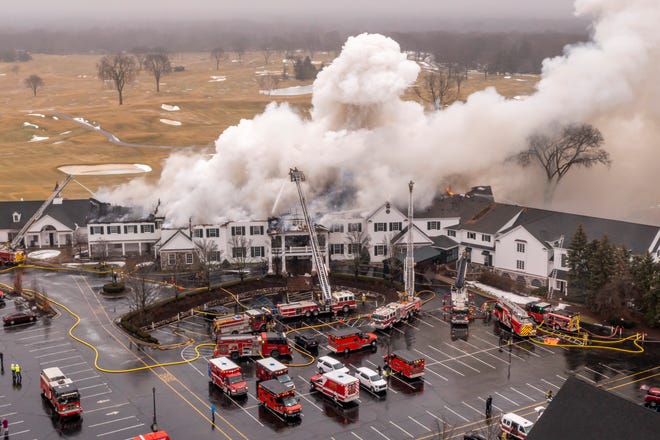 Smoke billows from the main building at Oakland Hills Country Club in Bloomfield Township on Thursday, Feb. 17, 2022.
