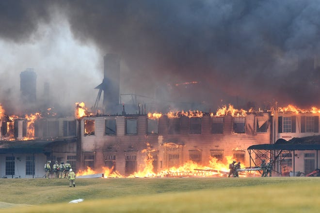 Fire engulfs the main building at the Oakland Hills Country Club in Bloomfield Township on Thursday, Feb. 17, 2022.