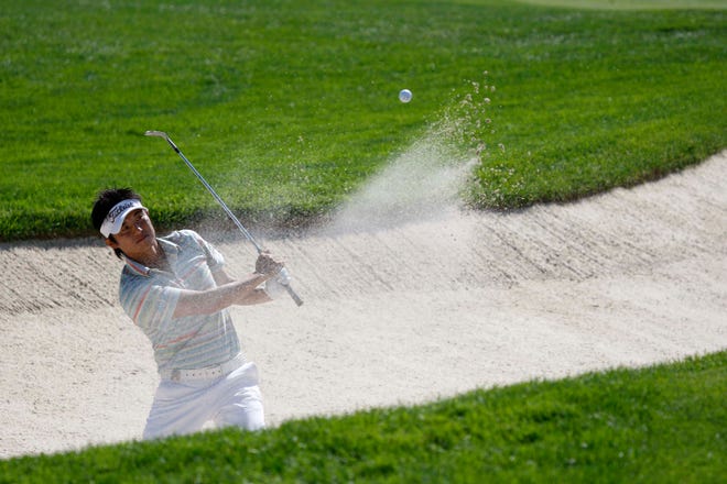 Ryuji Imada chips out of a sand trap onto the Ninth green during first-round action at the PGA Championiship, August 7, 2008.