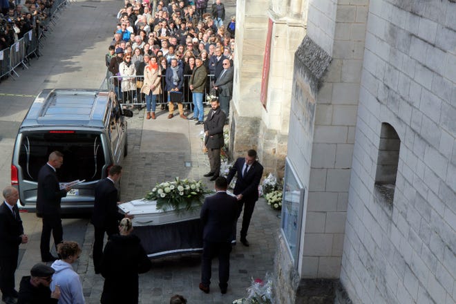 The coffin a of 12-year-old schoolgirl, known as Lola, is carried inside the church of Lillers for her funeral ceremony, in Lillers, northern France, Monday, Oct. 24, 2022. France has been "profoundly shaken" by the murder of a 12-year-old schoolgirl, whose body was found in a plastic box, dumped in a courtyard of a building in northeastern Paris.